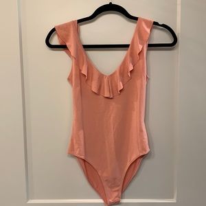 Ruffled peach body suit